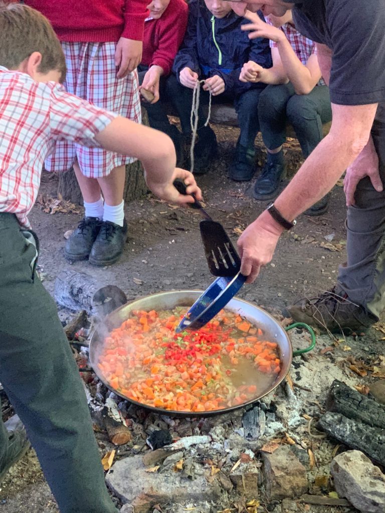 Y6 cook traditional Spanish Paella over the fire, Copthill School